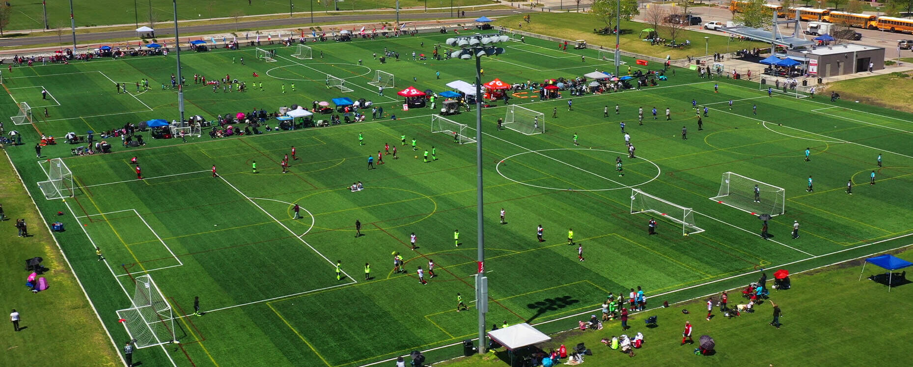 Aerial View Of Soccer Tournament With Mountain Backdrop