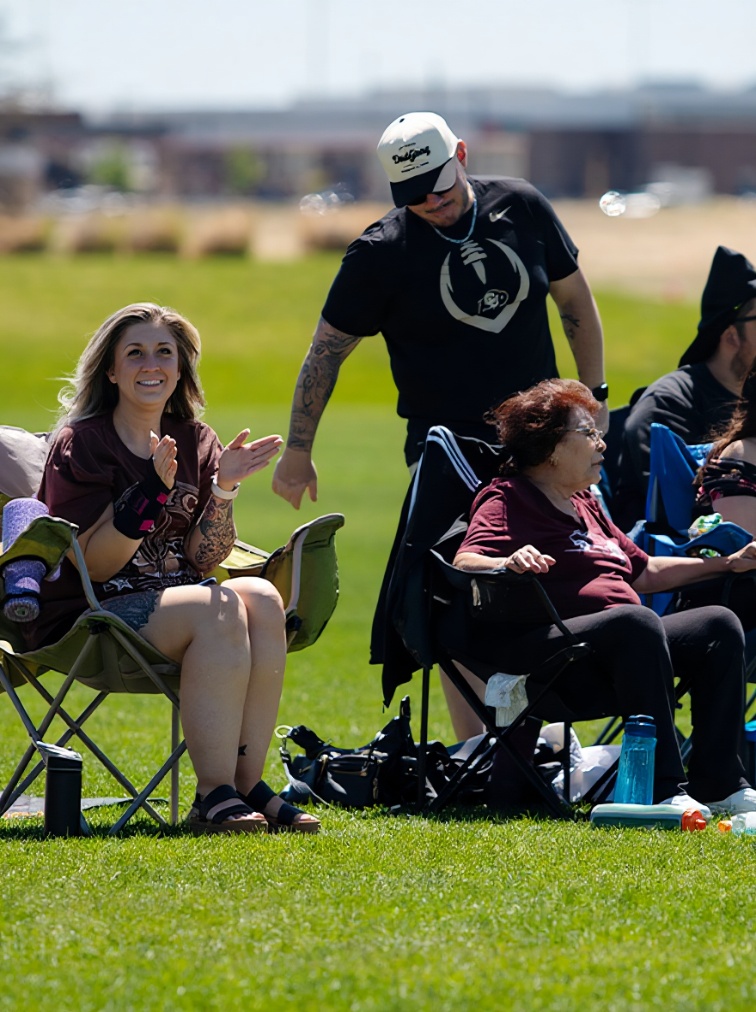 Woman Clapping For Team On Soccer Sideline