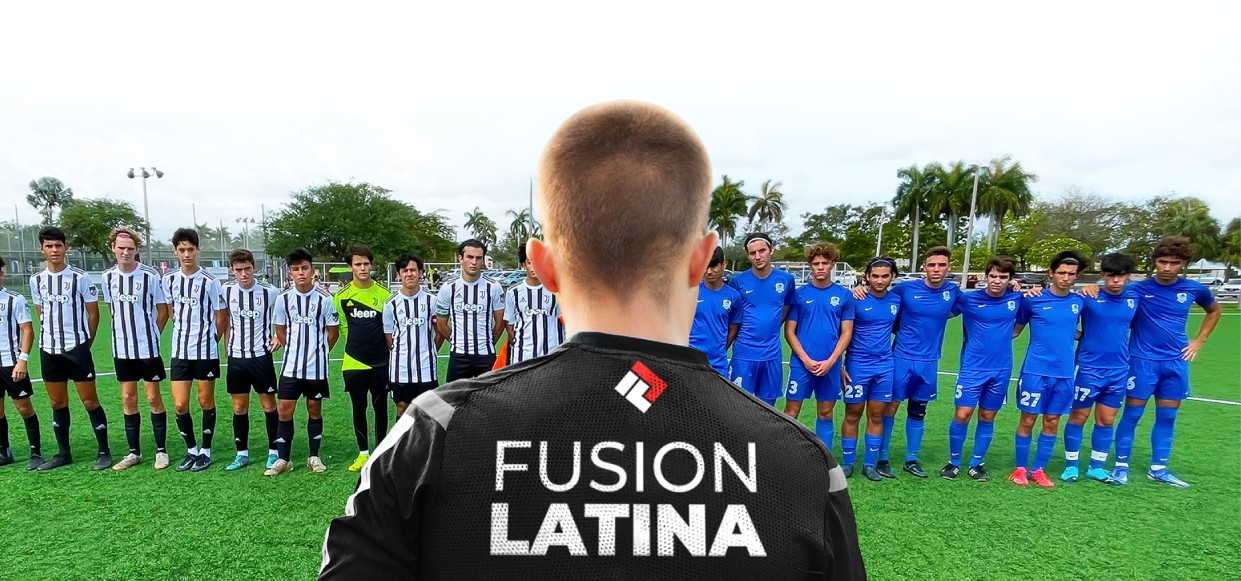 Fusion Latina SoccerTeam Lineup Young coach wearing a Fusion Latina jersey looking out at two opposing youth soccer teams (one in black and white stripes and one in solid blue uniforms) lined up on a grass field.